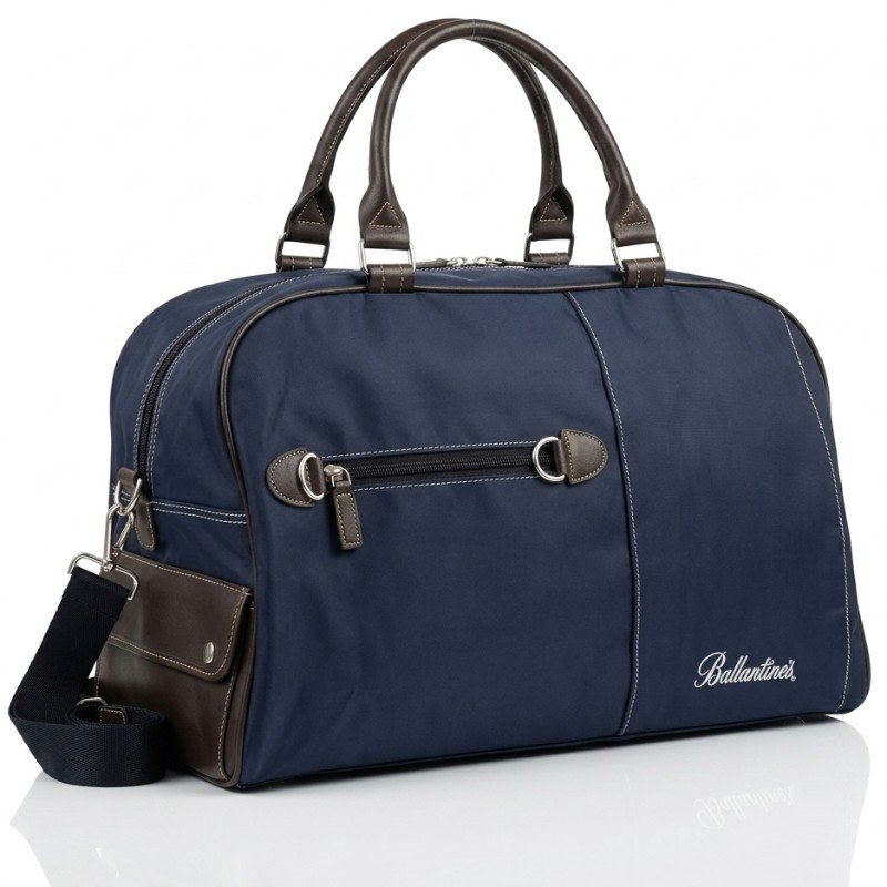 Ballantine's branded dark blue duffle bag with brown leather accents and a shoulder strap.