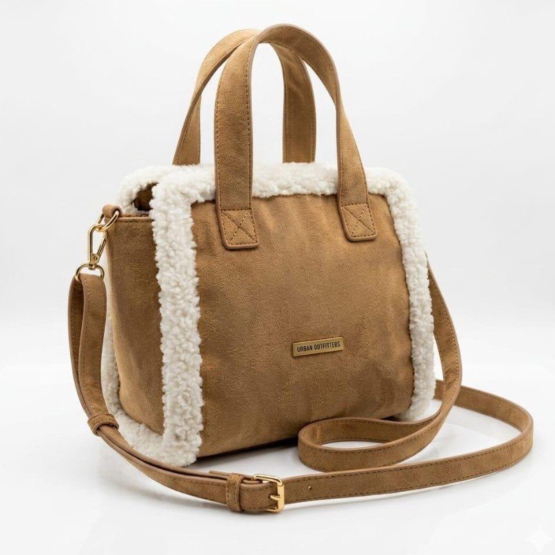 Urban Outfitters Borg Trim Mini Crossbody Bag featuring a faux suede exterior and a fluffy lining.