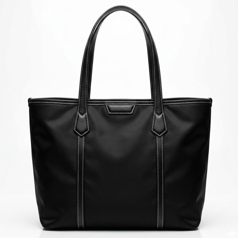 Black Zoe Rhea tote bag featuring contrast stitching and leather strap handles.