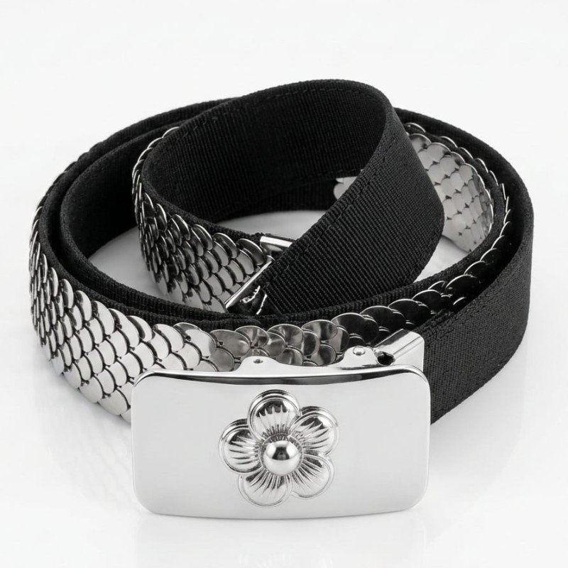 Vintage silver-tone metal scale belt featuring a floral buckle and elastic backing.
