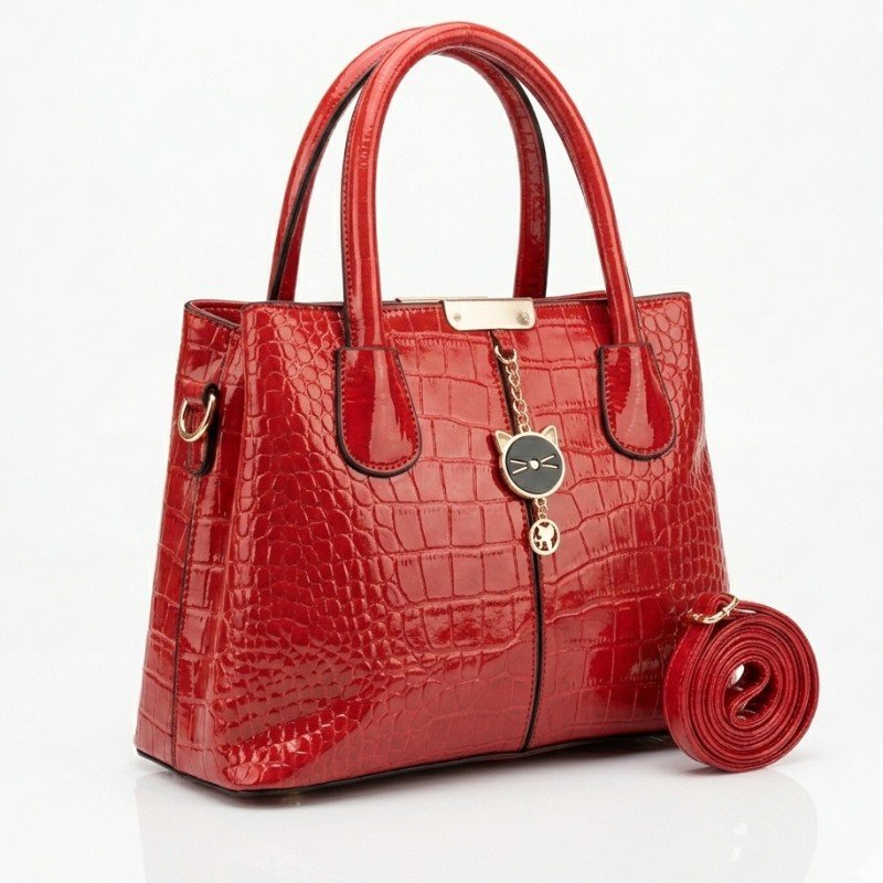 Red jelly leather handbag with a glossy crocodile pattern finish.