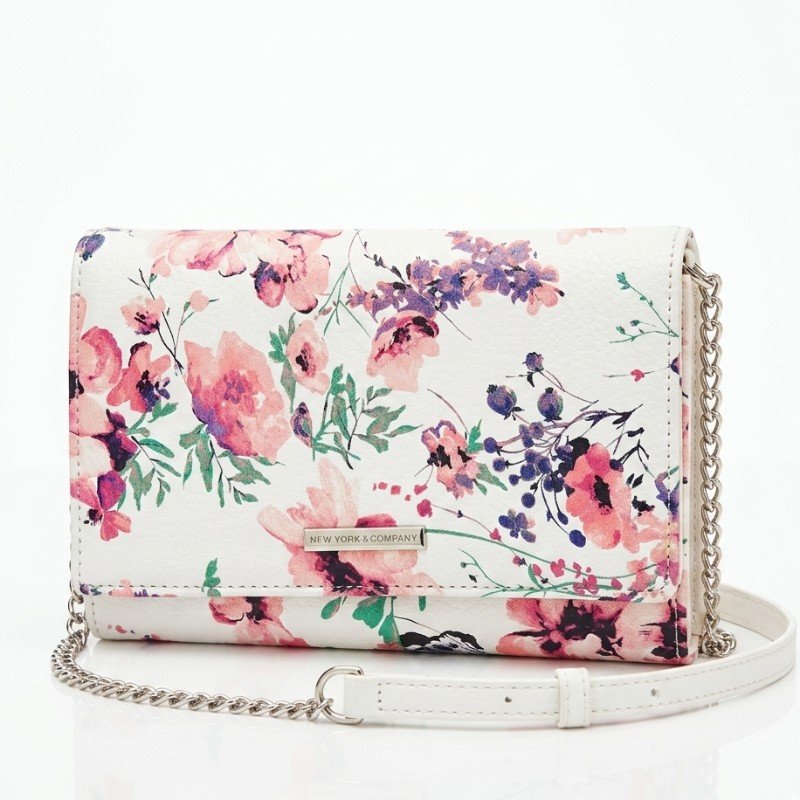 New York & Company white floral print crossbody bag with a silver-toned chain strap.