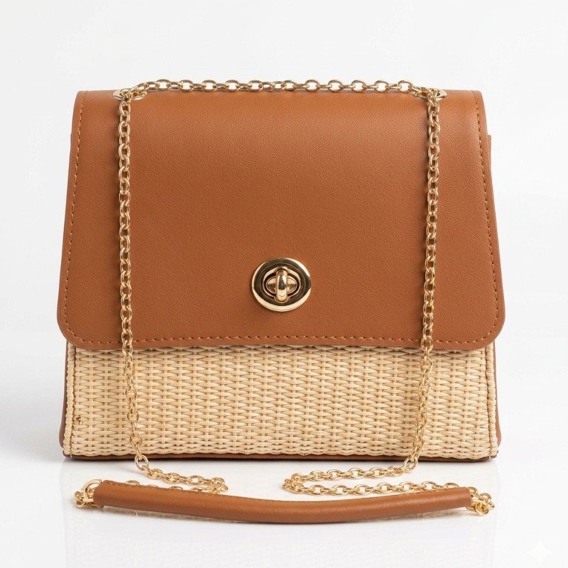 Little Box crossbody handbag in brown with a woven straw base and gold chain strap.