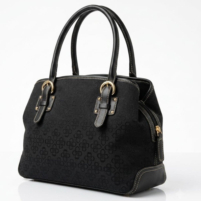 black Fossil jacquard shoulder bag features leather-trimmed handle