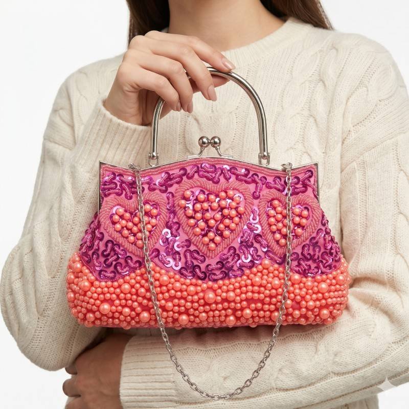 Beautiful Pink and orange embellished evening handbag featuring heart-shaped beadwork and a silver metal handle. - view 2