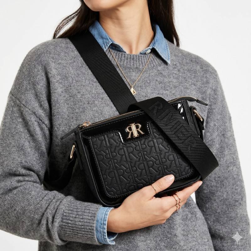 River Island black monogram emboss crossbody bag with a branded strap and gold hardware. - view 2