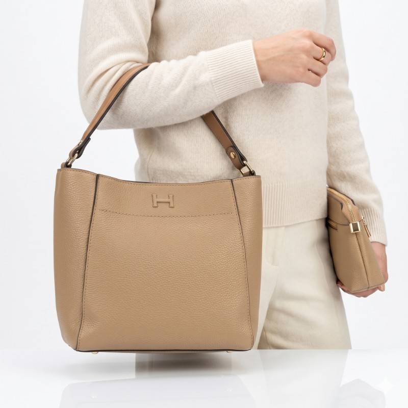 Camel-colored Adoro handbags consisting of a structured bucket bag and a matching pouch. view 2