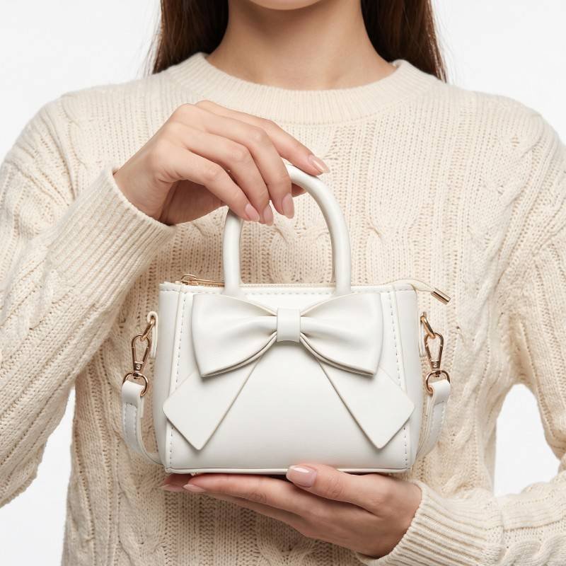 white PU leather mini handbag featuring a large bow decoration and a crossbody strap - view 2