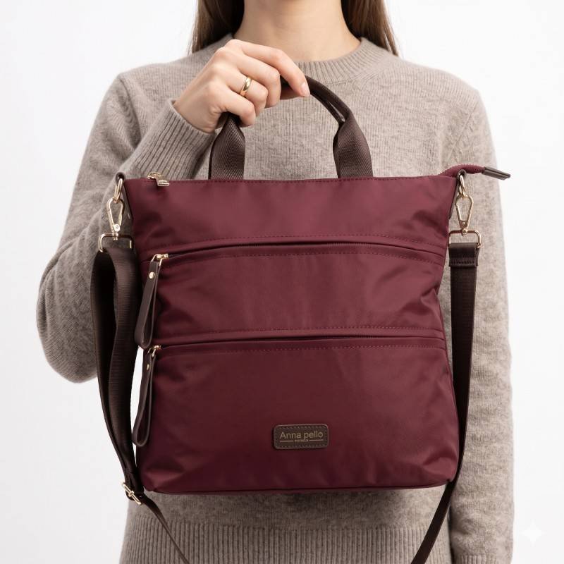 Anna Peilo bag features a durable nylon construction in a deep maroon color with multiple exterior zip pockets for organization - view 2