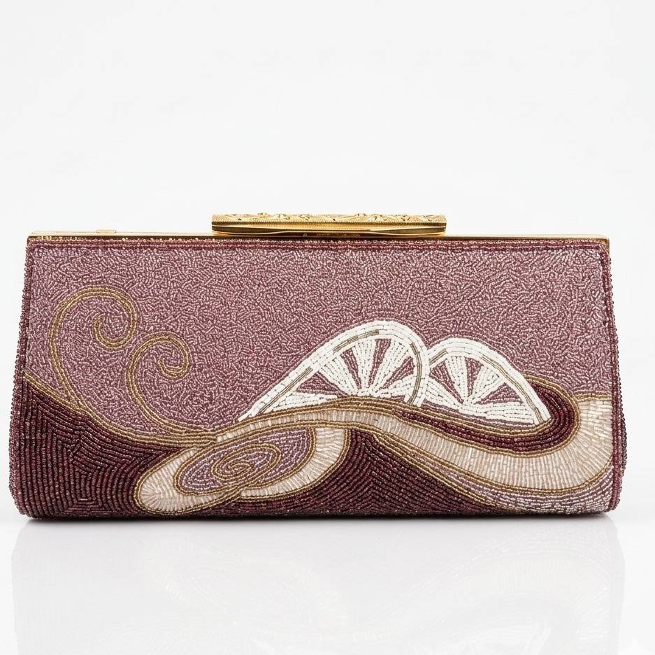 CARA Fashions "Ivory Palm Clutch" in purple features intricate beadwork and a metallic frame clasp